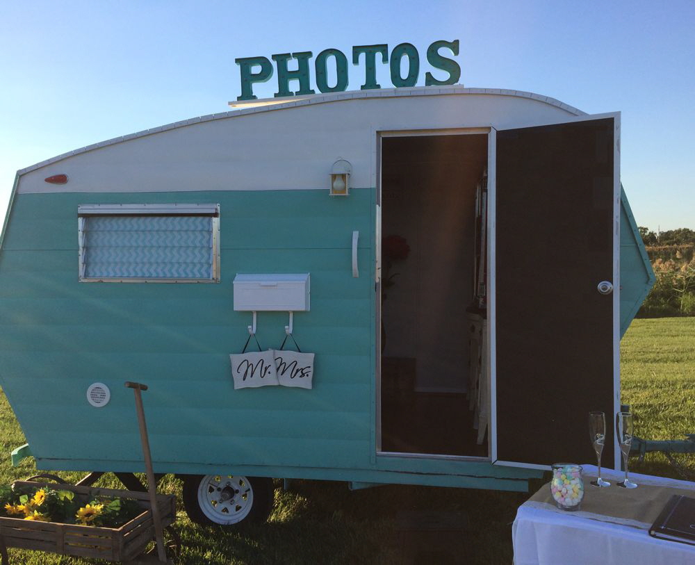 This is Claire. She has a teal-colored exterior, dark hardwood floors, recessed lighting, white wainscoting, and blue/gray paint on the inside.   CLICK ABOVE FOR MORE PHOTOS